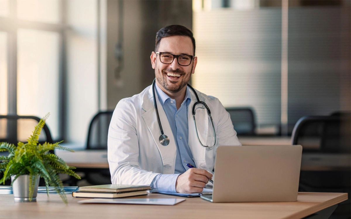 pch doctors smiling doctor with laptop for online medical marijuana consultation pch doctors smiling doctor with laptop for online medical marijuana consultation